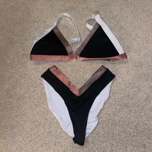 Black pink and white oneone bikini.